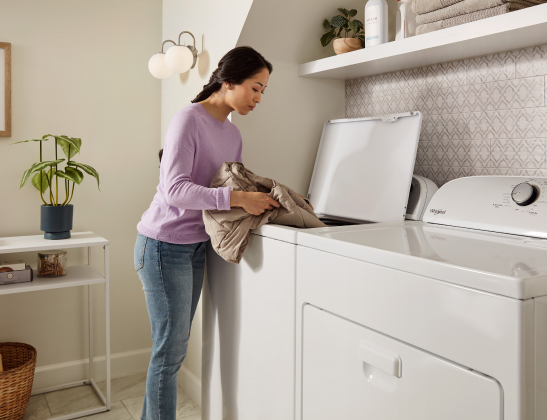 woman loading washer